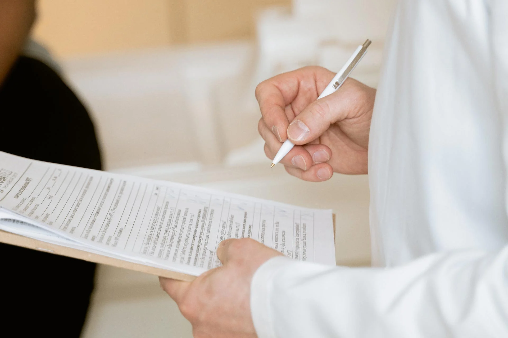 a-man-holding-a-document-to-sign.webp mortgage broker for investment property st albans new zealand