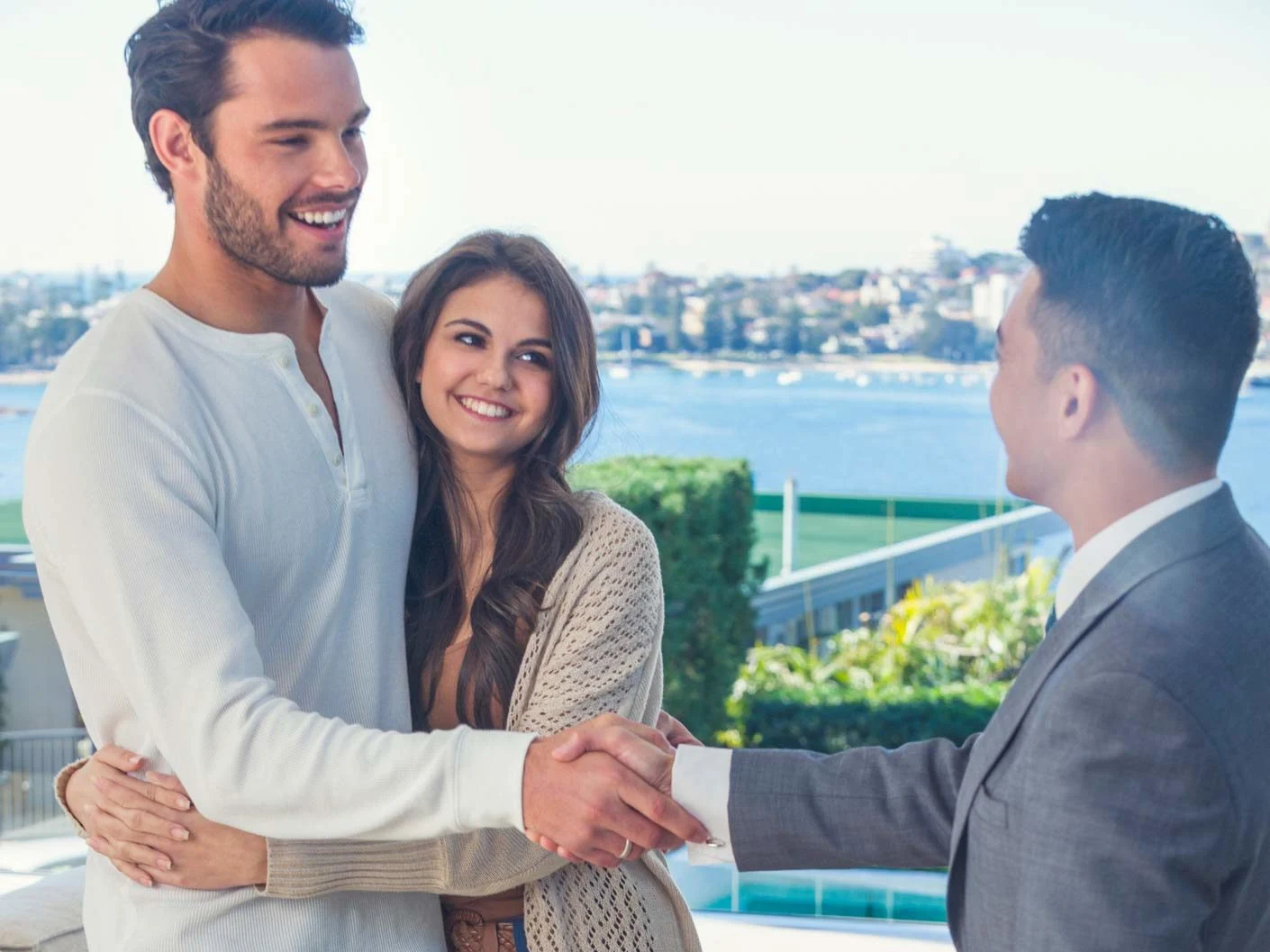 happy-couple-in-the-new-house-talking-with-financial-advisor-e1620085206859
